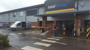 Power Wash Cleaning of Total Fitness Parking lot, Building Cleaning.